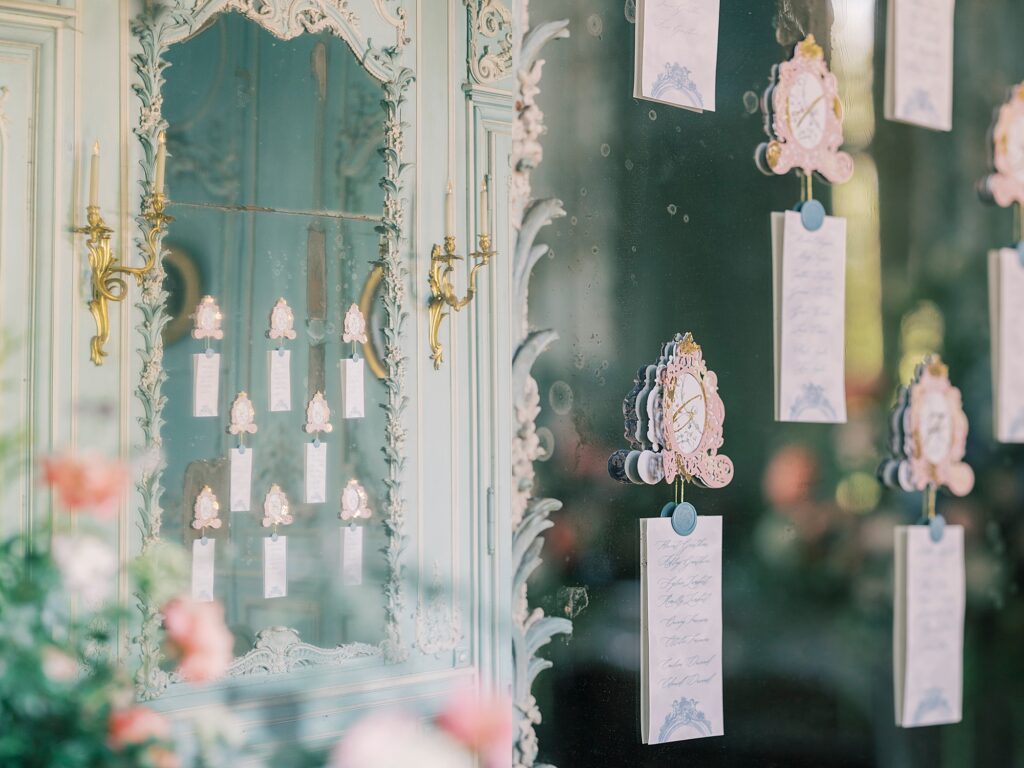 Refined French château wedding reception with elevated florals and custom stationery near Paris