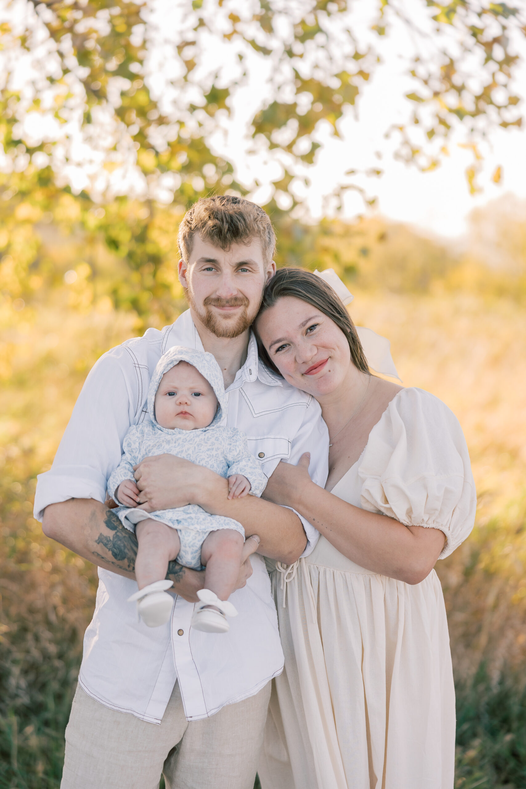 Family portrait session in La Crosse Wisconsin during fall with golden autumn leaves